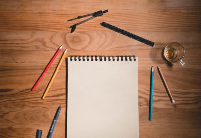 Image of a notepad and pencils