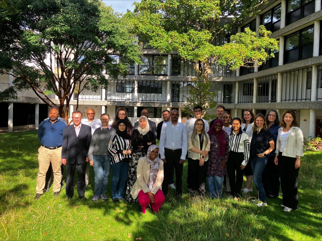 group photo of workshop participants at Wolfson College, Oxford